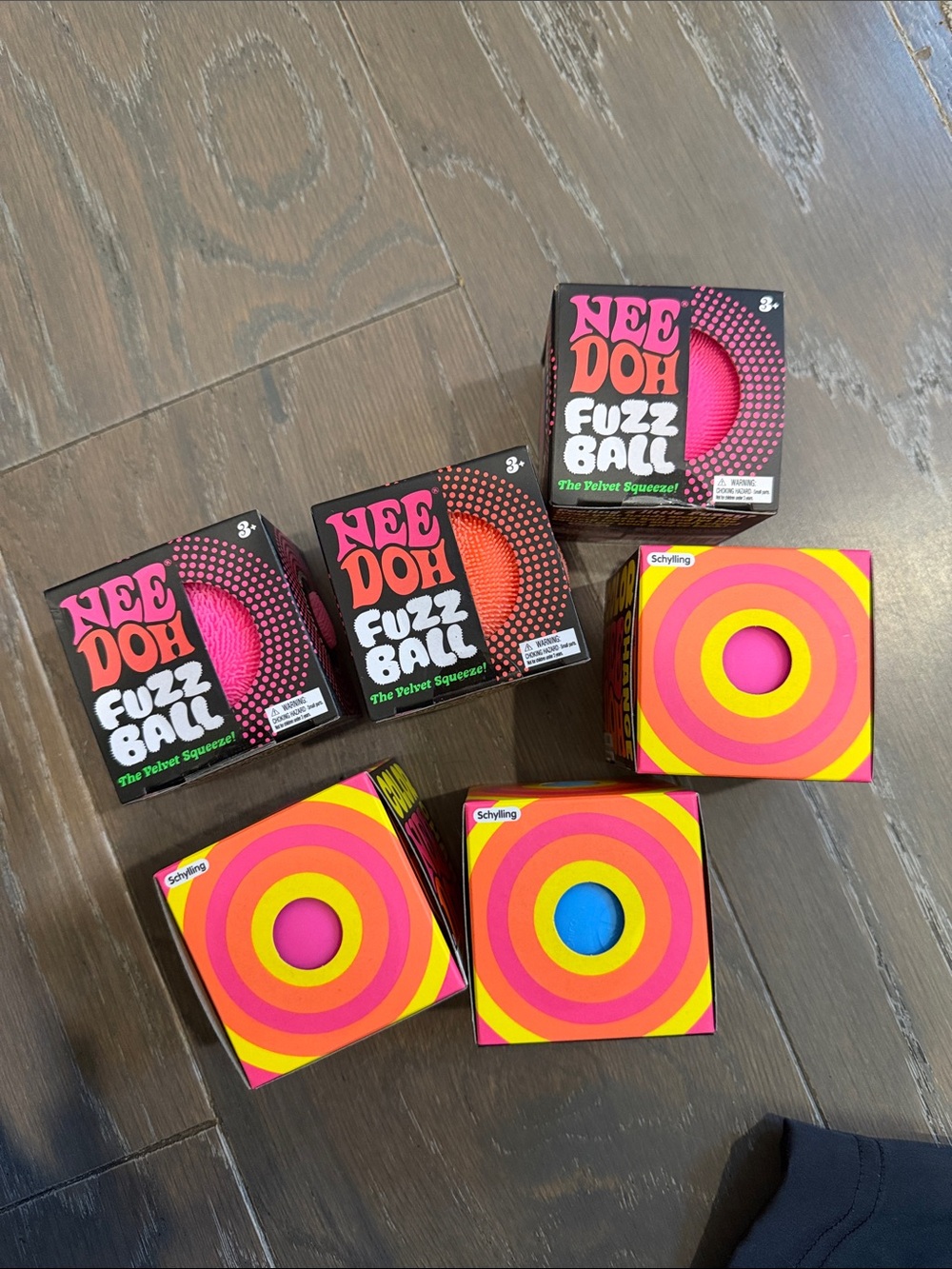 6 pack of NeeDohs. 3 fuzz ball 3 color change